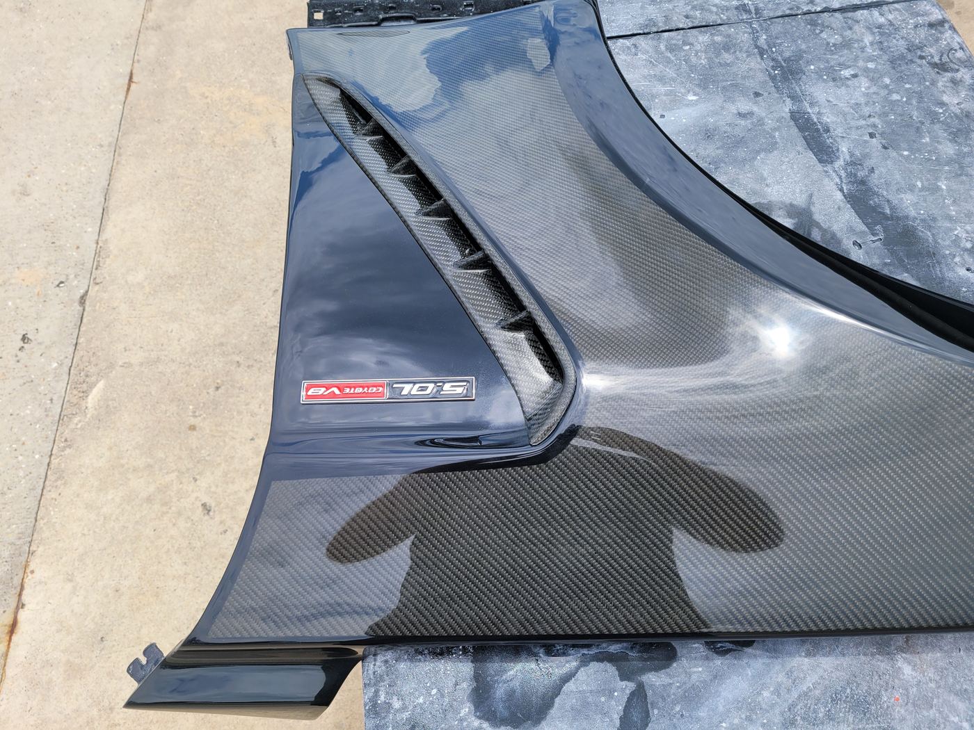 McLaren carbon fiber hood with vent — detail finish