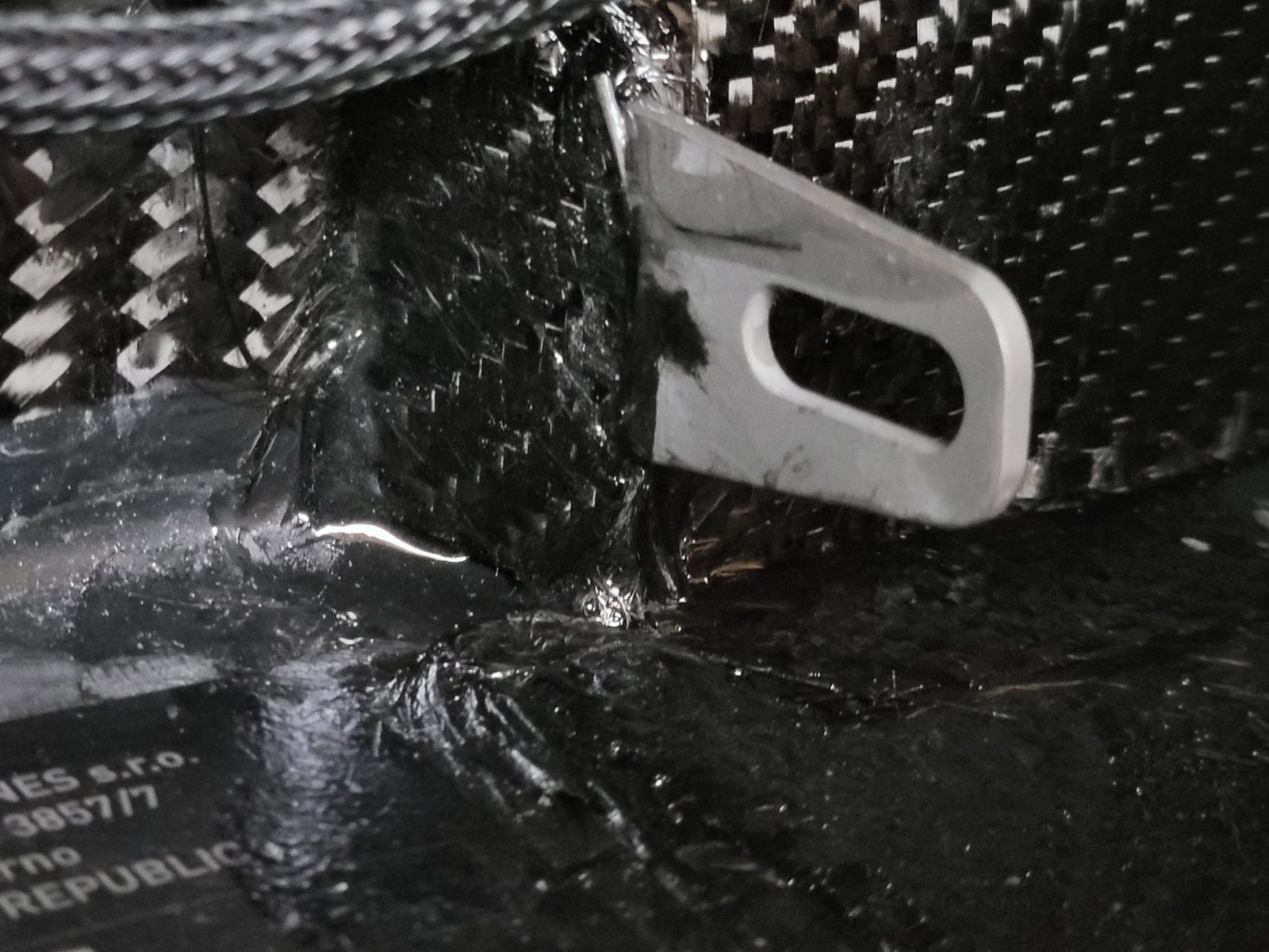 Jetsurf carbon fiber board interior with fresh carbon fiber layup repair around the bracket