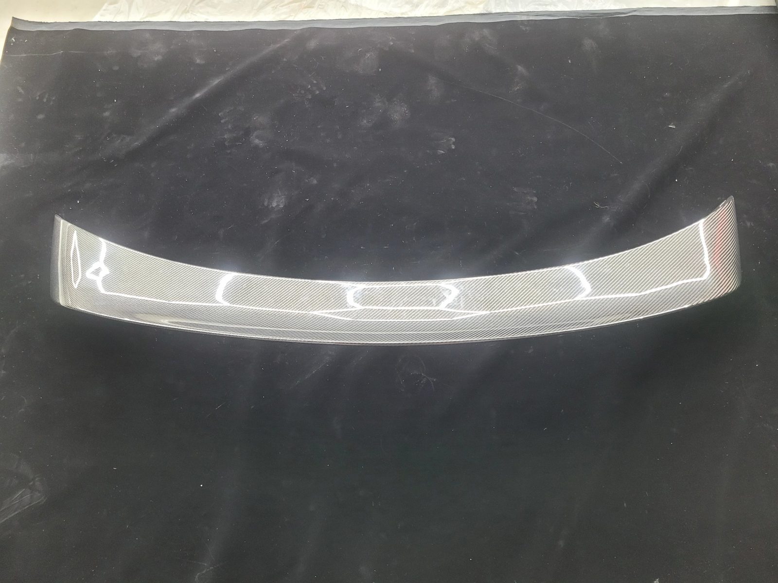 Twill-weave carbon fiber rear spoiler for a 2015 Roush Mustang, top view